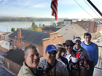 Bank of Washington employees dressed up as tourists on the 4th floor balcony for Halloween 2015