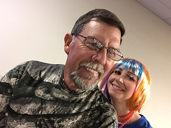 Bank of Washington employees dressed up as a hunter and a blue Skittle for Halloween 2015