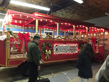 Bank of Washington employees decorating trolley for holiday parade