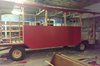Red trolley being built for fair parade