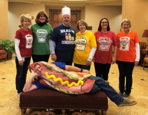 Employees dressed up as a hot dog and condiments