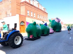 Fair Parade Float: Two little pigs and one big pig on Main St. 