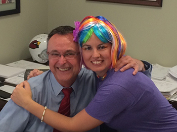 Bank of Washington employees dressed up as a purple Skittle and a banker for Halloween 2015