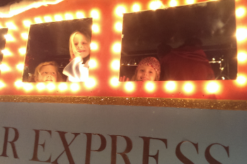 Little kids on the Polar Express train float