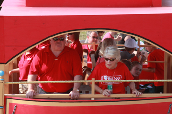 Bank of Washington employees on red trolley in Fair Parade