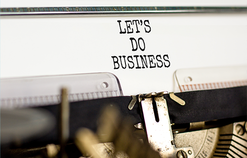 paper with the words of "let's do business" written in black ink